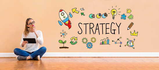 Strategy with young woman holding a tablet computer