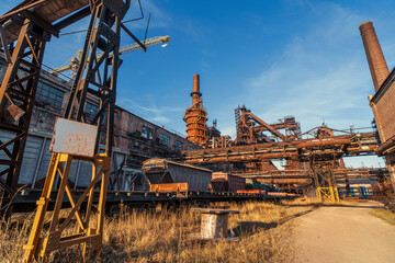 Fototapeta na wymiar Metallurgical factory with logistic railroad infrastructure and steel industrial architecture.
