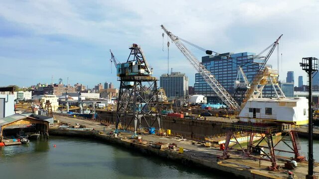 View of the Cranes, Ships, and Empty Ports at the Navy Yard in Brooklyn