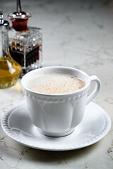 Alcoholic coffee cocktail with coffee liqueur and milk, alcoholic cocktail in a cappuccino coffee mug. Coffee with Irish whiskey and whipped cream