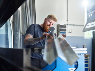 Inspector checking material while working at factory