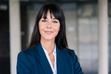 Smiling female professional in lobby