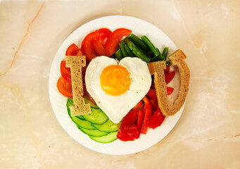 healthy breakfast with egg, bread, tomatoes slice, cucumber slice, and green beans for Valentine's day morning