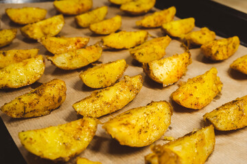 Baked potatoes in the oven close-up