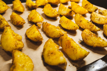 Baked potatoes in the oven close-up