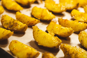Baked potatoes in the oven close-up