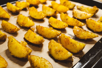 Baked potatoes in the oven close-up