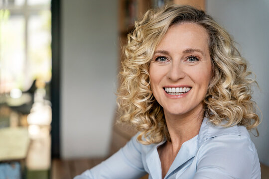 Smiling businesswoman with blond hair at office