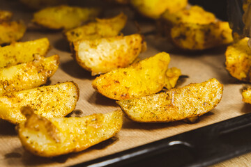 Baked potatoes in the oven close-up