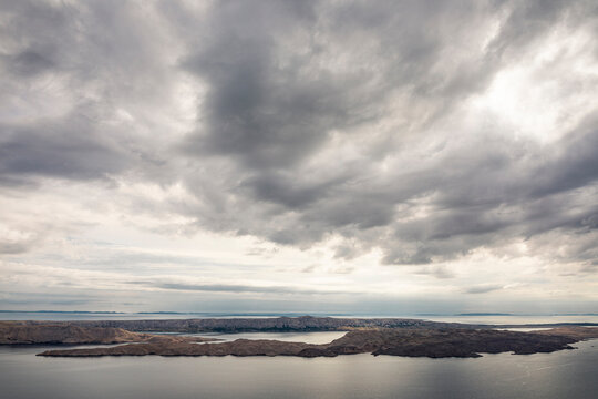 Gray clouds above sea with islands