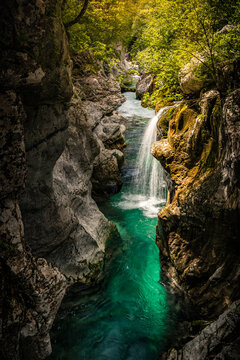 Turquoise river and waterfall