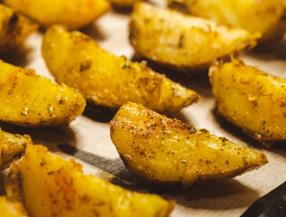 Baked potatoes in the oven close-up