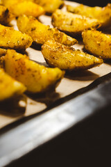 Baked potatoes in the oven close-up