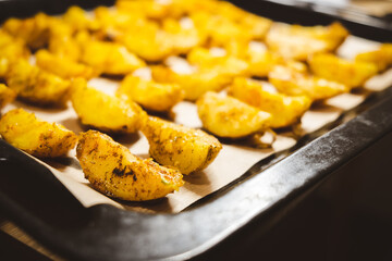 Baked potatoes in the oven close-up