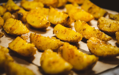Baked potatoes in the oven close-up