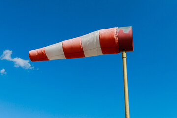 Windsock flag. Windsock indicator of wind on runway airport