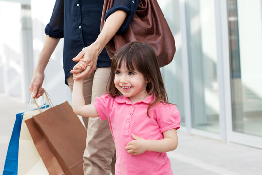 Mother and daughter with shopping bags