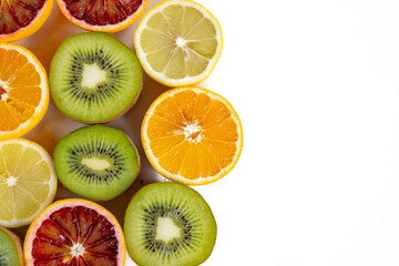 set of fruits with vitamin c, kiwi, lelon, red orange, yellow orange in a cut isolate on white