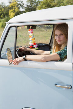 Portrait of young woman in campervan