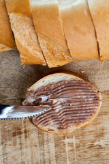 sliced white bread with sweet chocolate butter spread