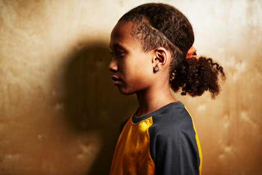 Boy with pony tail, side view