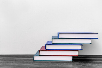 Stacked notebooks on wooden table