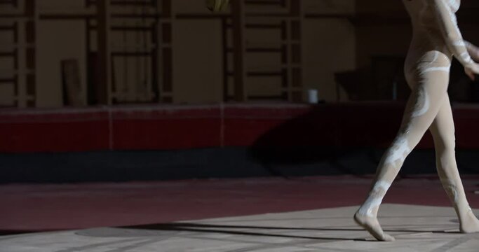 Aerial silks performer is letting go of the rope and walking on stage, 4k