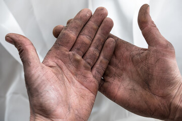 working man's strong hands wrinkled dirty palms with calluses