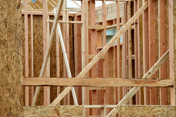 Interior frame of new wooden house under construction