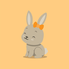 The rabbit with the little ribbon hairclip on her ears is sitting