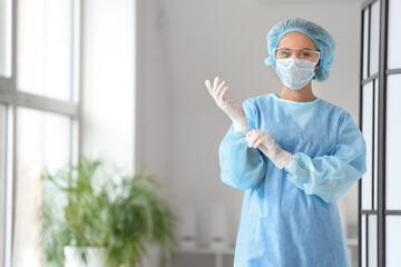 Portrait of female surgeon in clinic