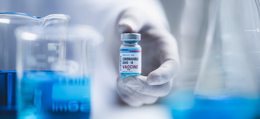 fight against COVID-19, coronavirus vaccine research in hospital laboratory, professional scientists holds bottle of new vaccine for virus cure treatment injection, medicine clinical during pandemic