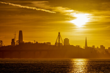 Ocean with sunset skyline with shadow of the San Francisco city
