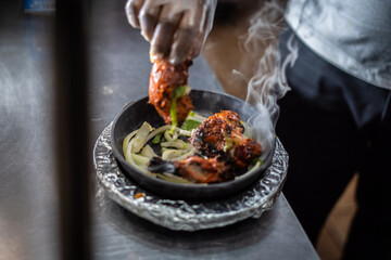 Indian kebab platter in sizzling plate