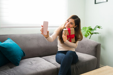Hispanic woman video chatting with her boyfriend