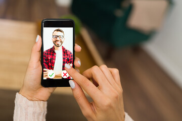 Woman swiping men's photos on a dating app