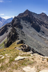 Hiking trail in Aosta valley, Cogne, Italy. View of the wonderful ridge crossed by the col garin. Photo taken at an altitude of 2900 meters.