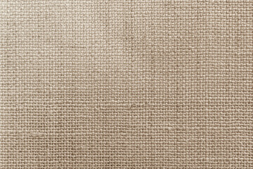 Jute hessian sackcloth canvas woven texture pattern background in light beige cream brown color blank empty