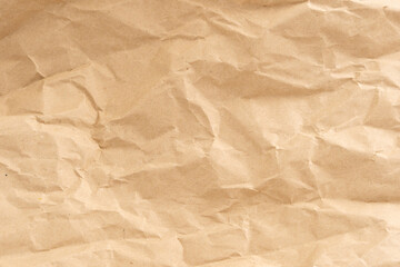 Fototapeta premium Crumpled brown paper texture perfect for background structure. Packaging material with rough wrinkles. The grunge textured surface is a vintage backdrop.