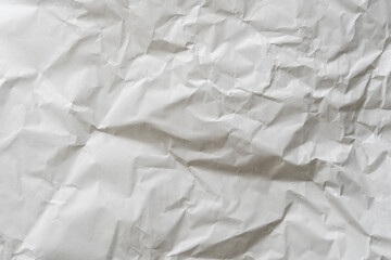 Crumpled white paper texture perfect for background structure. Packaging material with rough wrinkles. The grunge textured surface is a vintage backdrop.