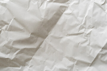 Crumpled white paper texture perfect for background structure. Packaging material with rough wrinkles. The grunge textured surface is a vintage backdrop.