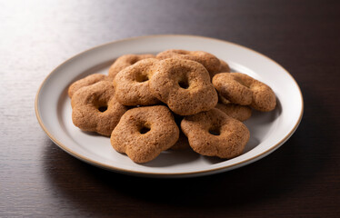 Japanese baked goods set against a wooden background. Sobaboro