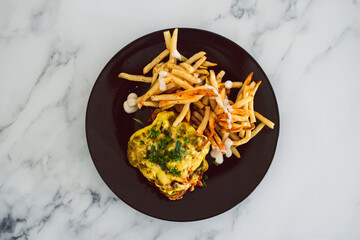 plant-based food, vegan parmigiana with plant-based schnitzel dairy-free cheese and french fries