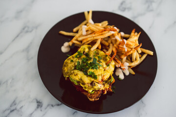 plant-based food, vegan parmigiana with plant-based schnitzel dairy-free cheese and french fries