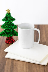 White mug on white background with christmas elements concept