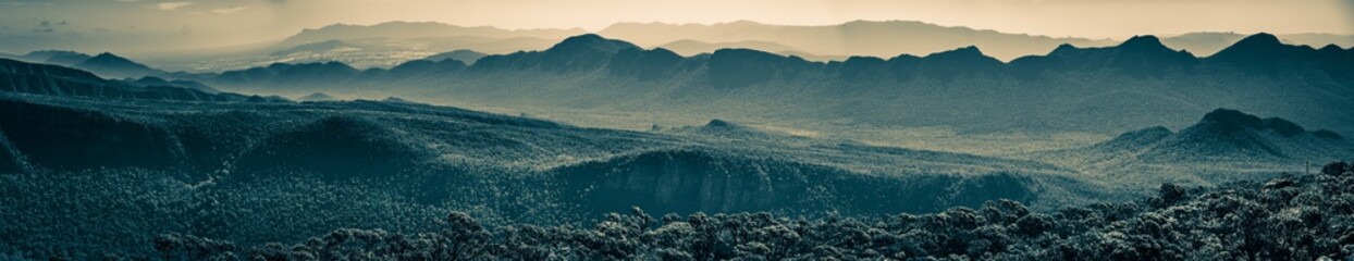 Wide panoramic banner of mountain ridges in monochrome sepia tones. Grampians, Australia