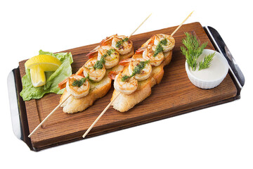 Grilled shrimp shashlik. Seafood, shellfish. Shrimp shashlik with herbs on a wooden board for serving. Isolated.