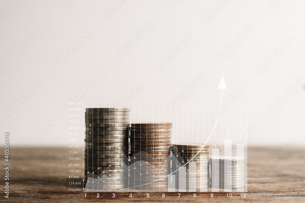 Wall mural Double exposure of graph and rows of coins for finance and business concept.