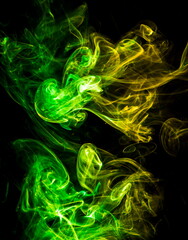 Colored smoke on black background