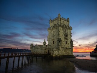 Panorama sunset view of medieval historic defense fortification bastion Torre Belem Tower in Tagus...